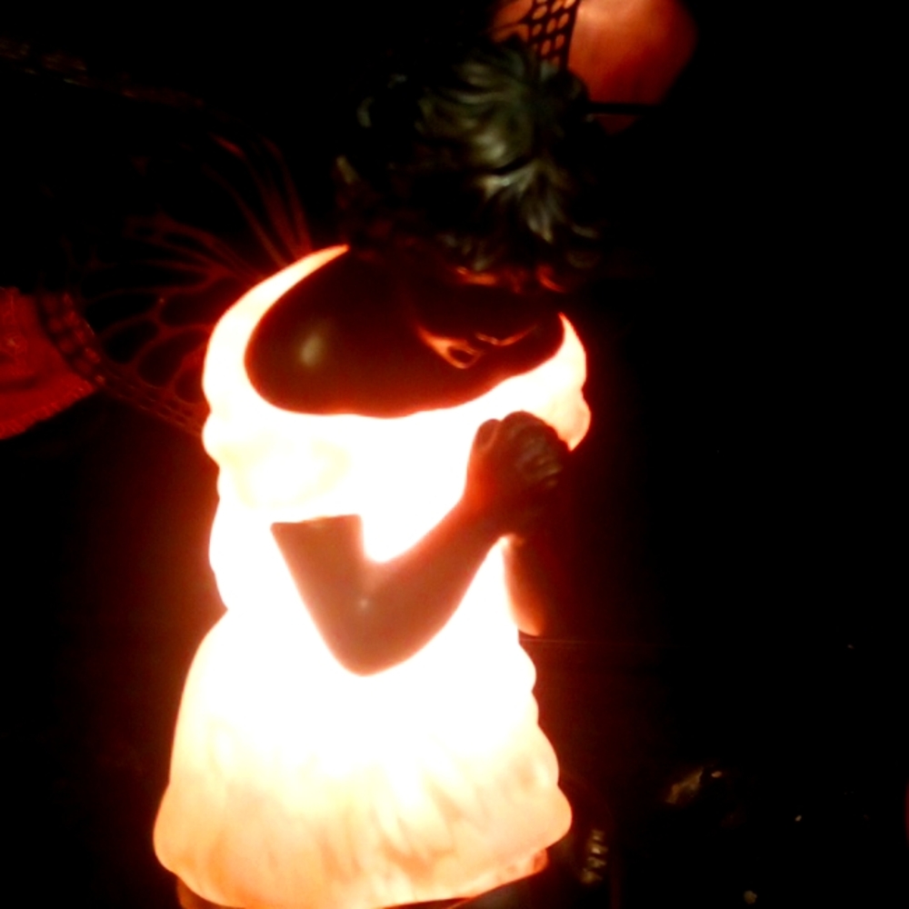 Angel fairy that lights up, she is beautiful praying.